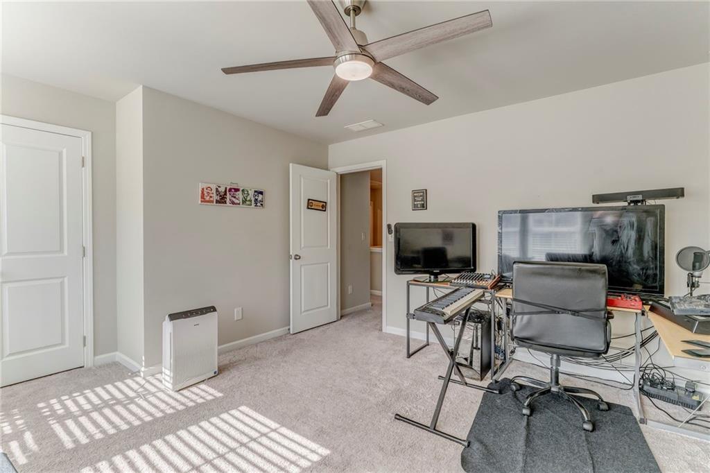 122 Old Mill Drive Calhoun, GA 30701 - Photo 16 of 25 a living room with furniture and a flat screen tv