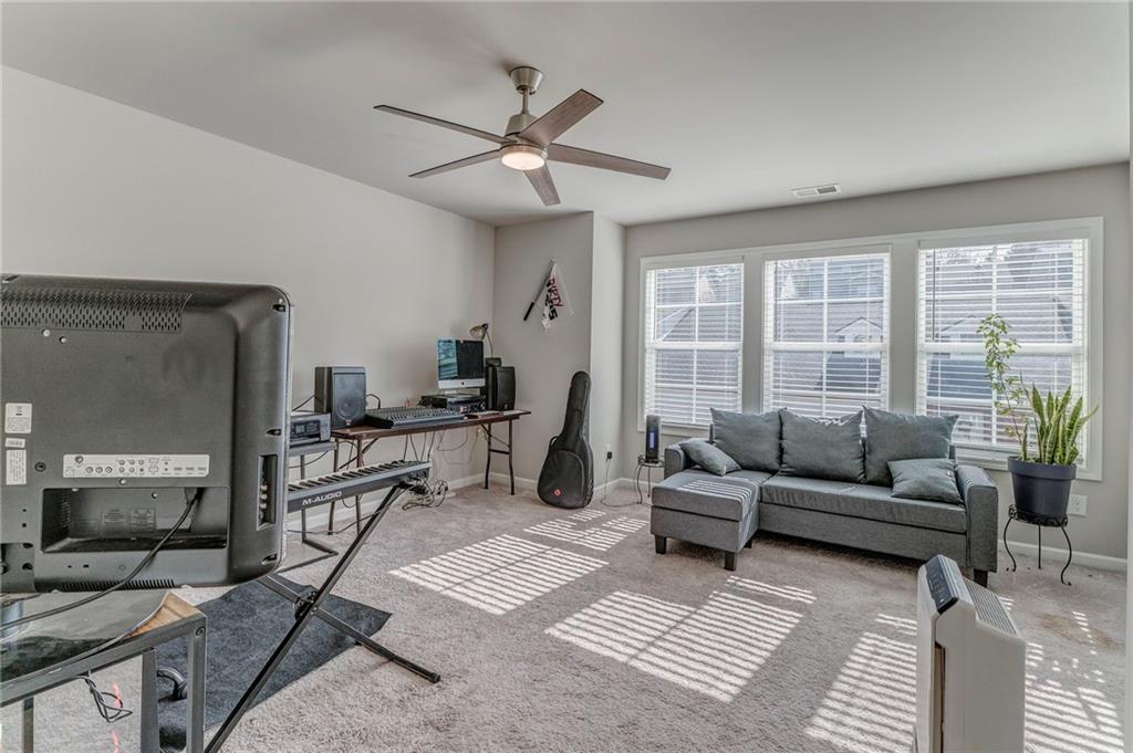 122 Old Mill Drive Calhoun, GA 30701 - Photo 17 of 25 a living room with furniture and a fireplace