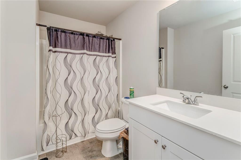 122 Old Mill Drive Calhoun, GA 30701 - Photo 18 of 25 a bathroom with a sink toilet and shower