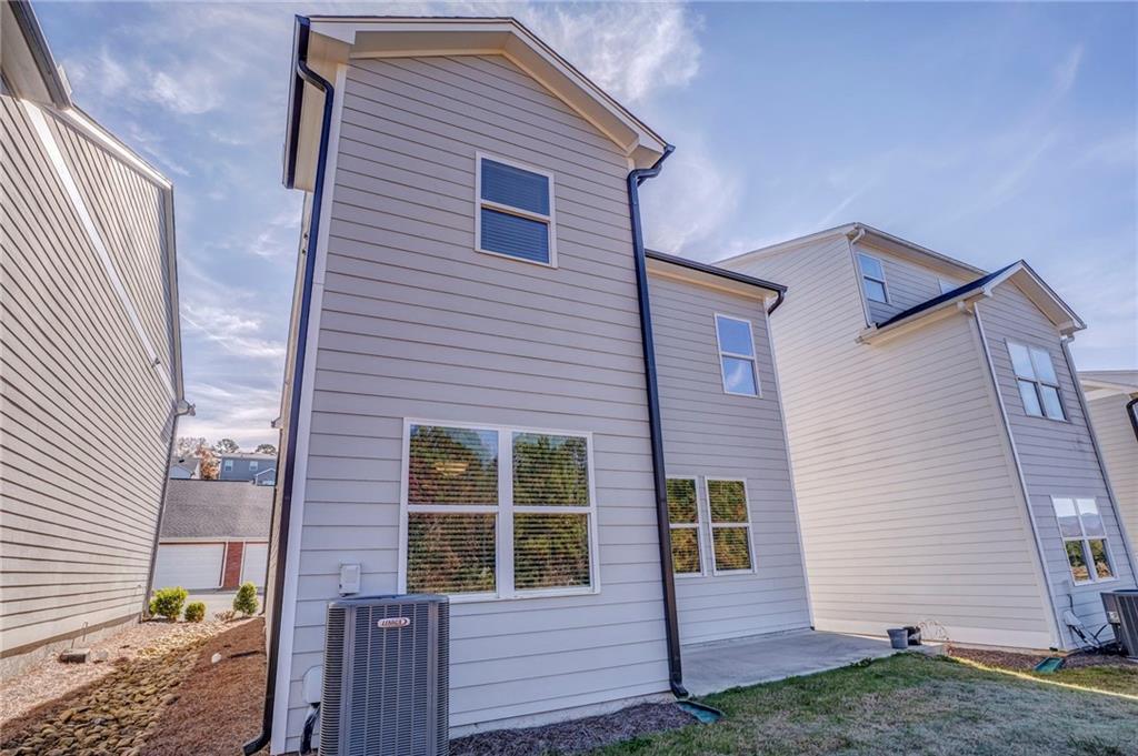 122 Old Mill Drive Calhoun, GA 30701 - Photo 21 of 25 a view of a house with a yard and wooden deck