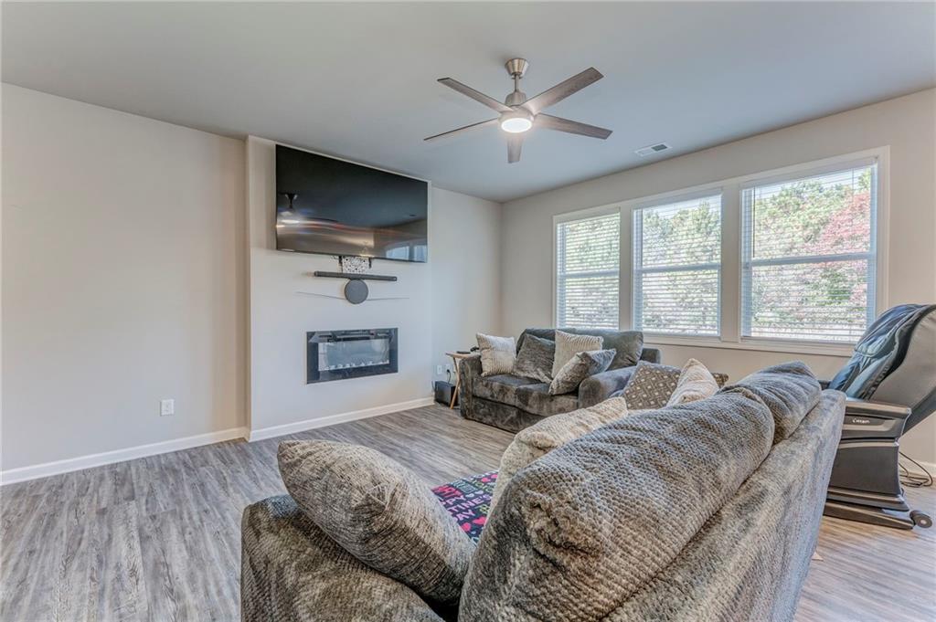 122 Old Mill Drive Calhoun, GA 30701 - Photo 5 of 25 a bedroom with a bed and a flat screen tv