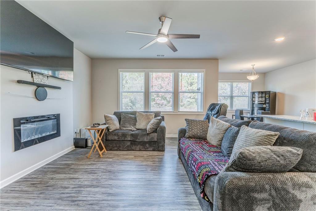 122 Old Mill Drive Calhoun, GA 30701 - Photo 7 of 25 a living room with furniture and a fireplace