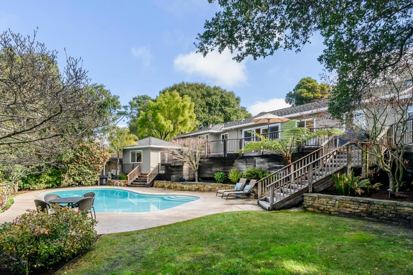 2950 Summit Drive Hillsborough, CA 94010 - Photo 1 of 27 a view of an house with swimming pool and sitting area