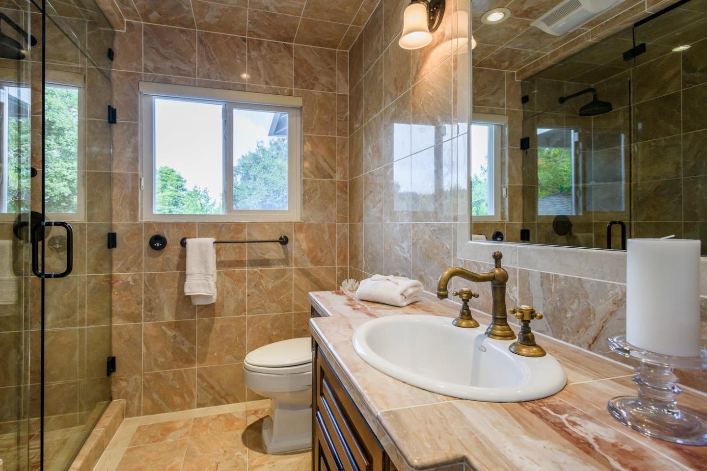 2950 Summit Drive Hillsborough, CA 94010 - Photo 11 of 27 a bathroom with a sink toilet and shower