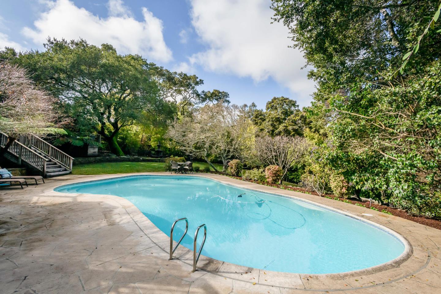 2950 Summit Drive Hillsborough, CA 94010 - Photo 19 of 27 a view of a swimming pool with a yard
