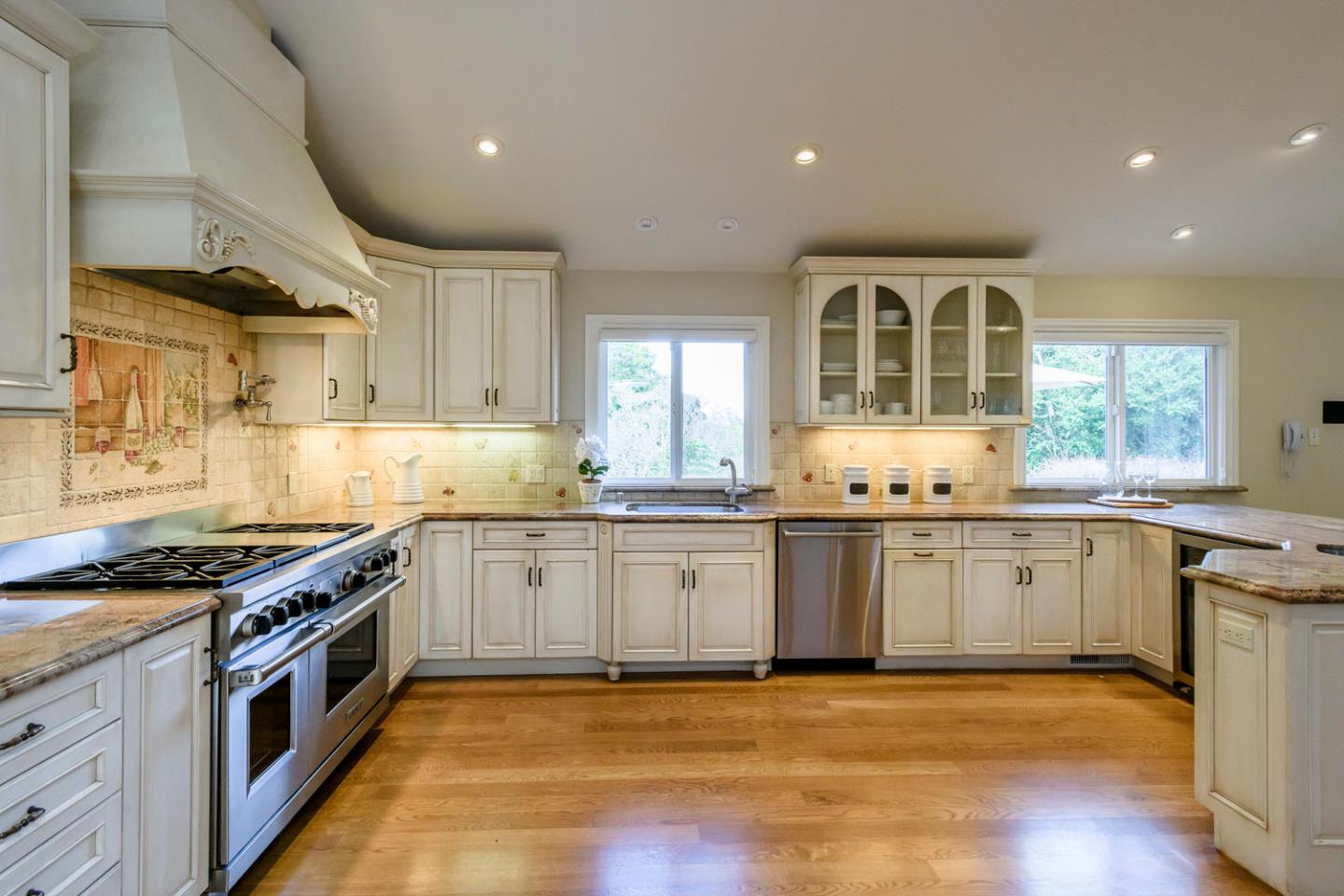 2950 Summit Drive Hillsborough, CA 94010 - Photo 5 of 27 a large kitchen with stainless steel appliances granite countertop a stove and a sink