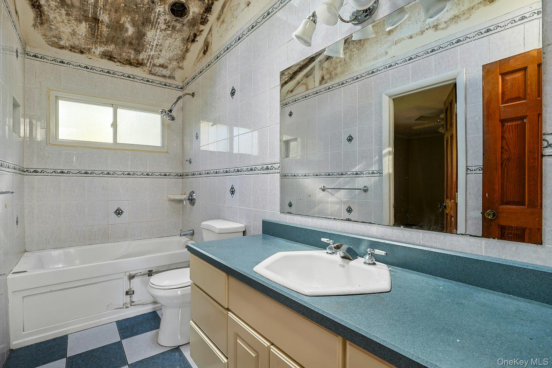 78 Croton Dam Road Ossining, NY 10562 - Photo 19 of 37 a bathroom with a sink and a mirror