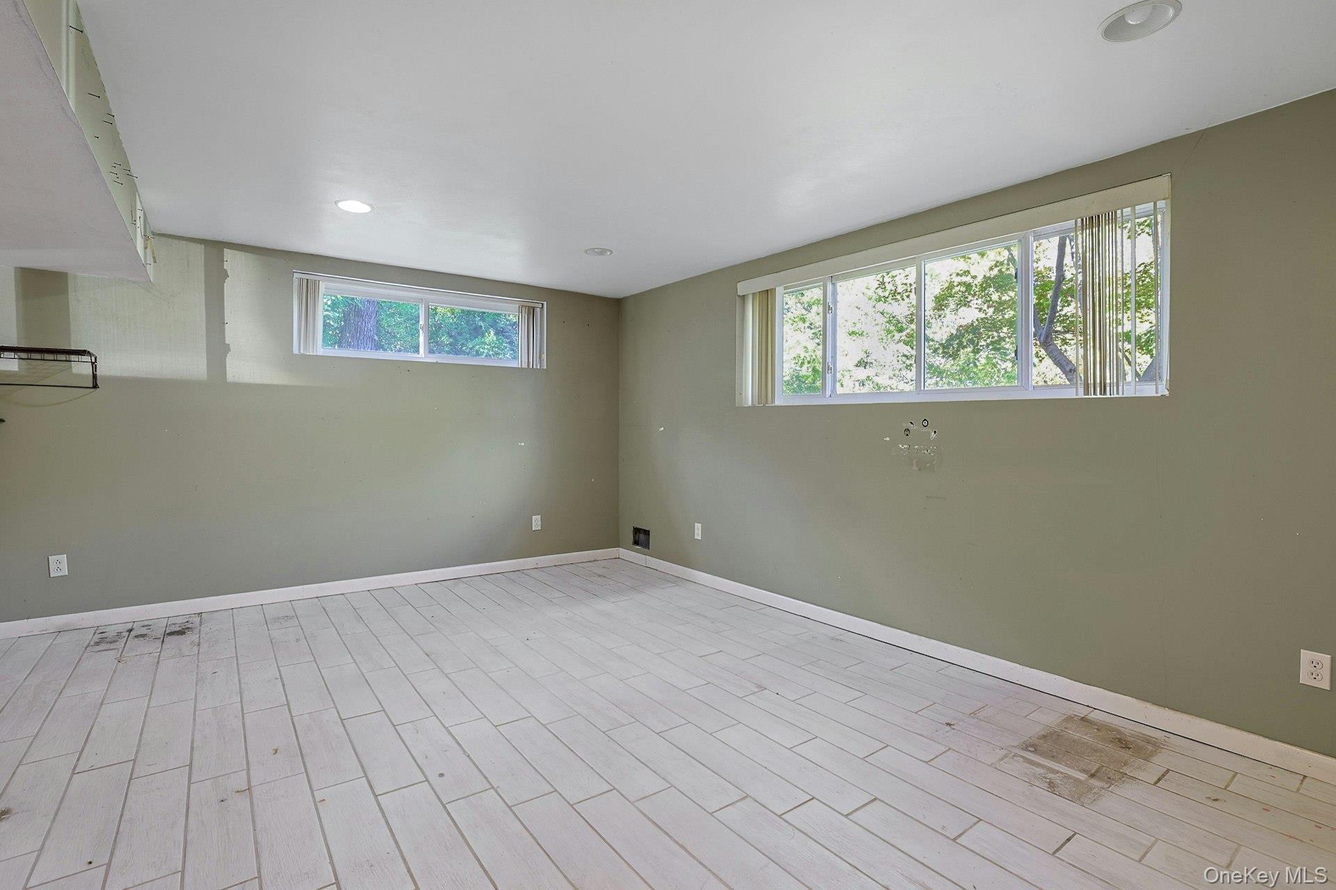78 Croton Dam Road Ossining, NY 10562 - Photo 21 of 37 a view of an empty room with wooden floor and a window