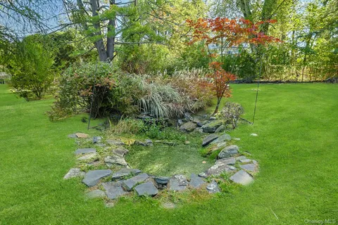 a backyard of a house with lots of green space