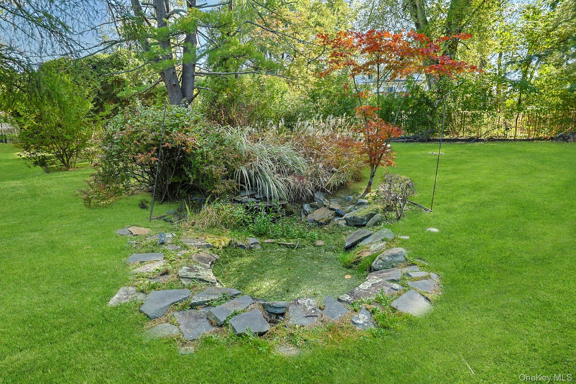 78 Croton Dam Road Ossining, NY 10562 - Photo 35 of 37 a backyard of a house with lots of green space