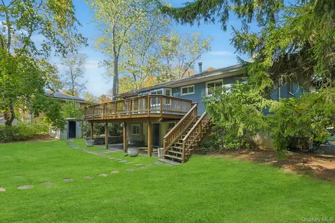 a view of a house with a backyard
