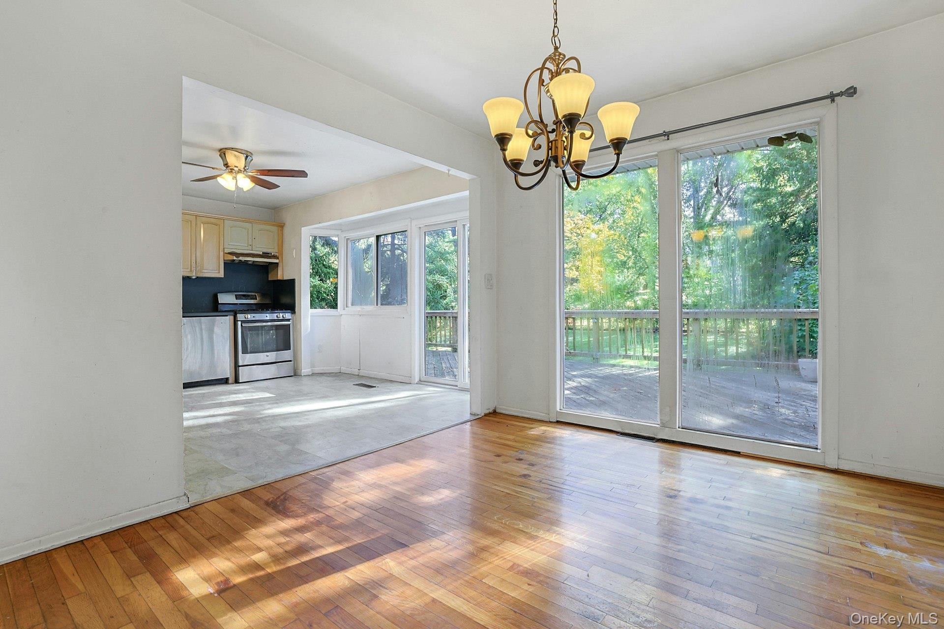 78 Croton Dam Road Ossining, NY 10562 - Photo 8 of 37 a view of an entryway with wooden floor and chandelier