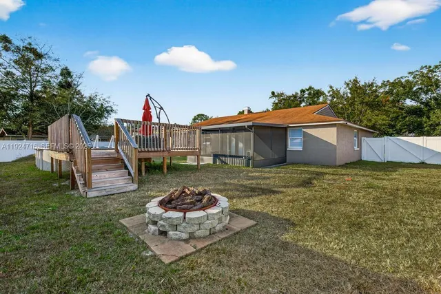 a view of a house with a yard porch and furniture