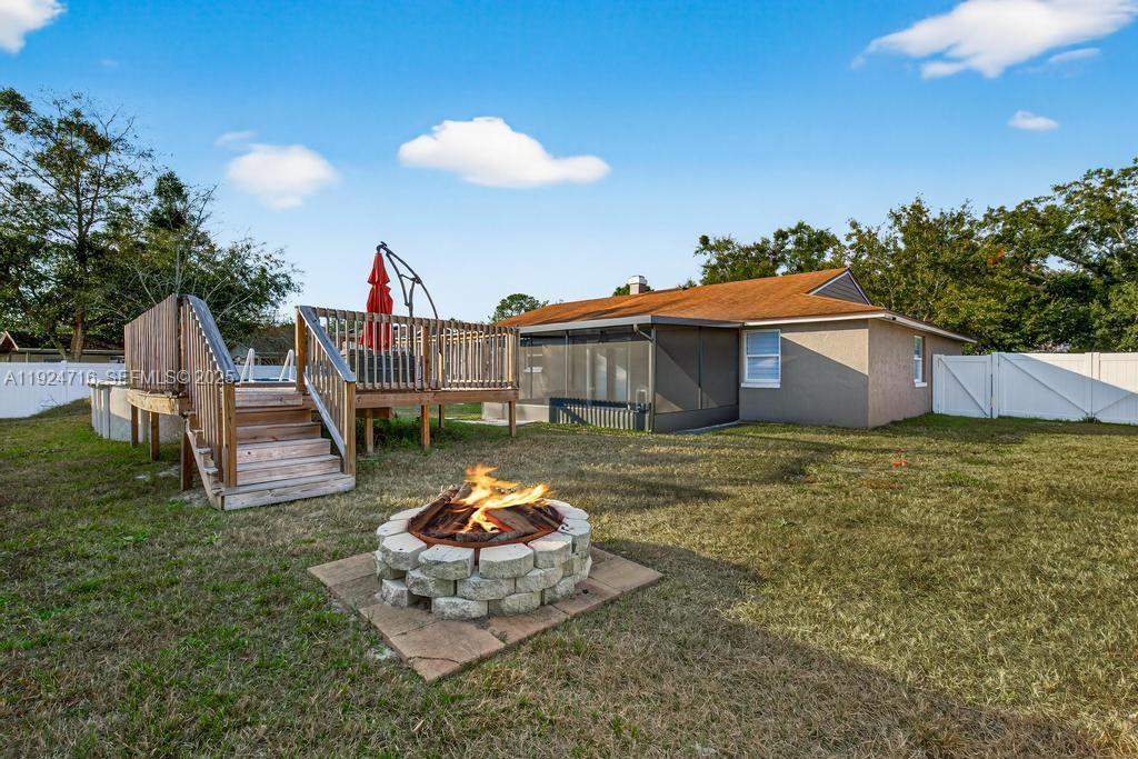 8210 Sailmaker Lane Jacksonville, FL 32210 - Photo 13 of 61 a view of a house with a yard porch and furniture