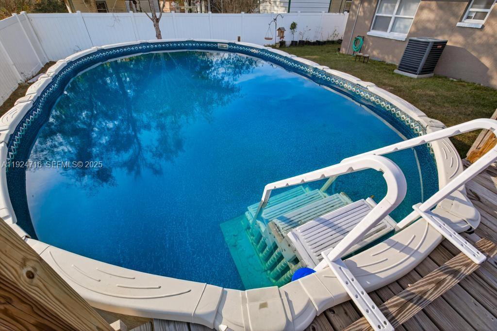 8210 Sailmaker Lane Jacksonville, FL 32210 - Photo 14 of 61 a view of a balcony with chair and wooden floor