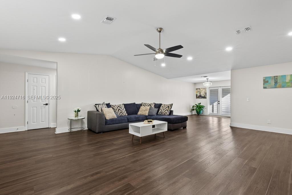 8210 Sailmaker Lane Jacksonville, FL 32210 - Photo 18 of 61 a living room with furniture and wooden floor