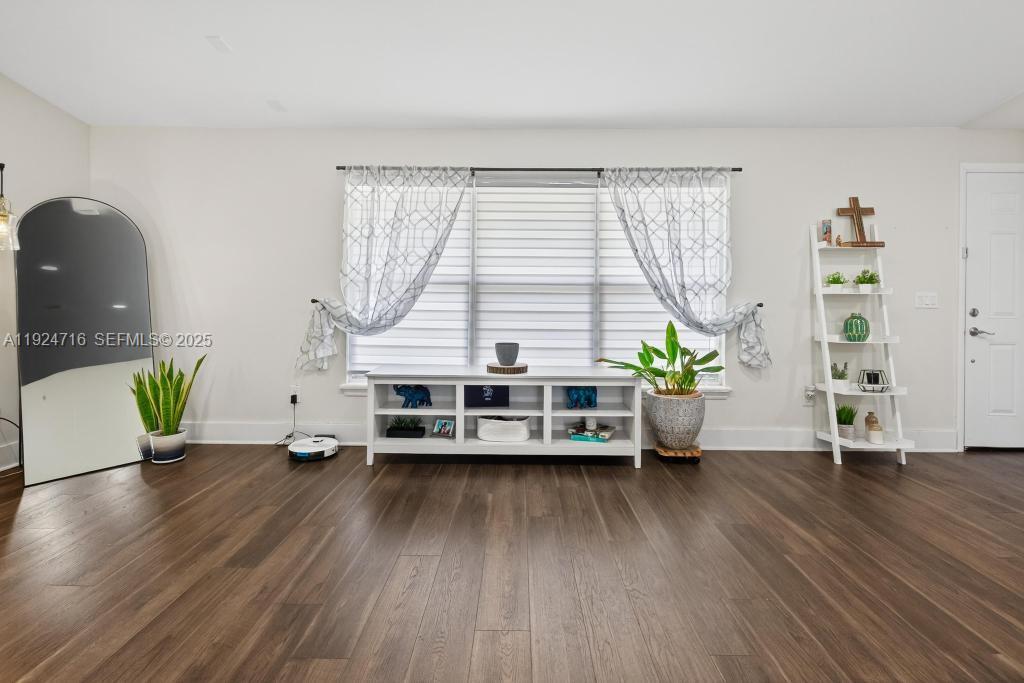 8210 Sailmaker Lane Jacksonville, FL 32210 - Photo 21 of 61 a living room with furniture and a wooden floor