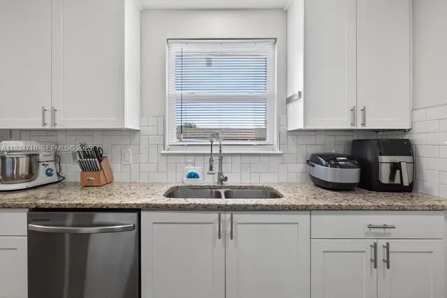 a bedroom with a bed and a chair