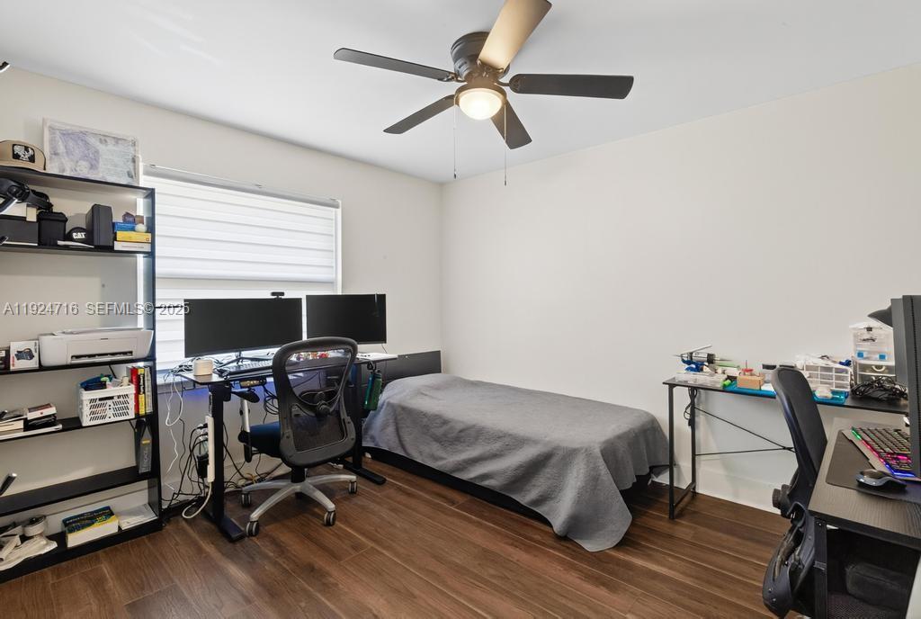 8210 Sailmaker Lane Jacksonville, FL 32210 - Photo 37 of 61 a bedroom with a bed and a chair