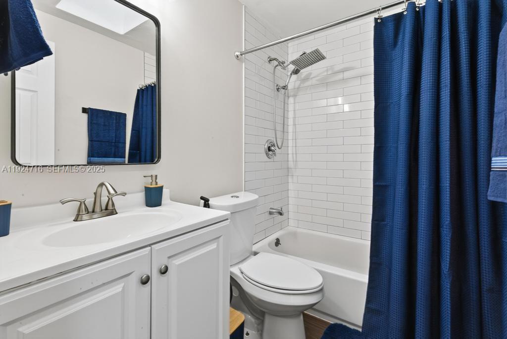 8210 Sailmaker Lane Jacksonville, FL 32210 - Photo 39 of 61 a bathroom with a sink toilet and shower