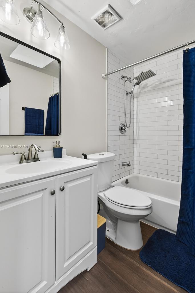 8210 Sailmaker Lane Jacksonville, FL 32210 - Photo 40 of 61 a bathroom with a sink toilet a mirror and shower