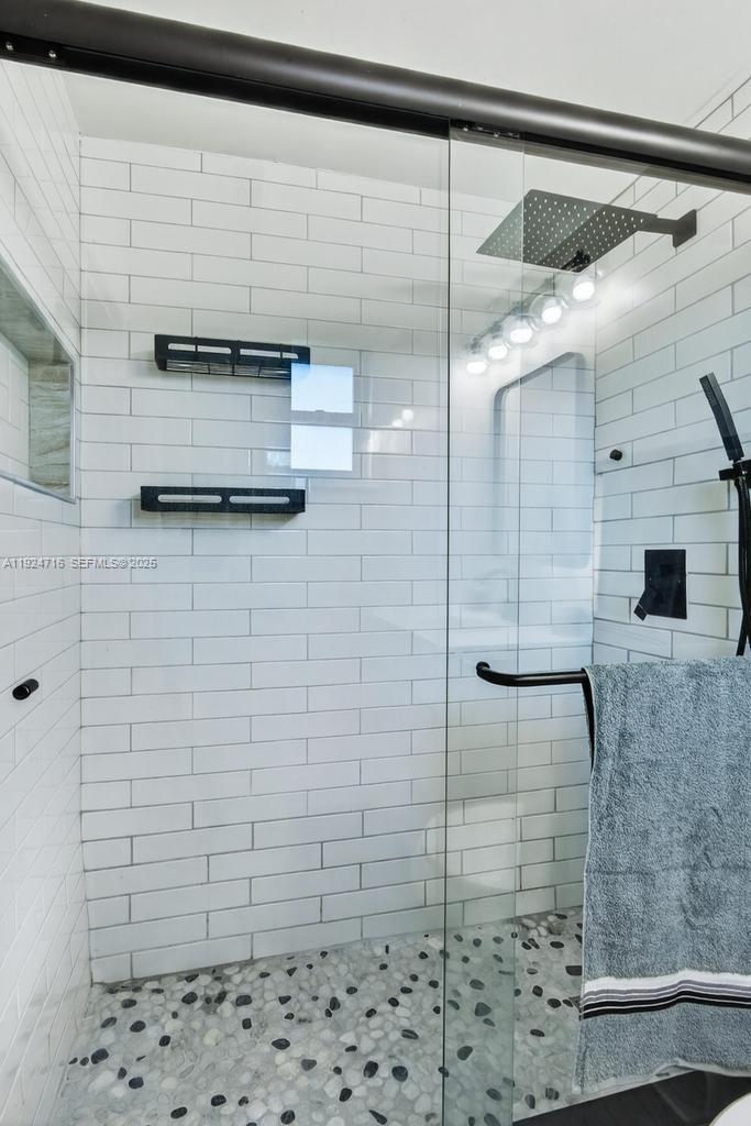 8210 Sailmaker Lane Jacksonville, FL 32210 - Photo 52 of 61 a bathroom with a shower