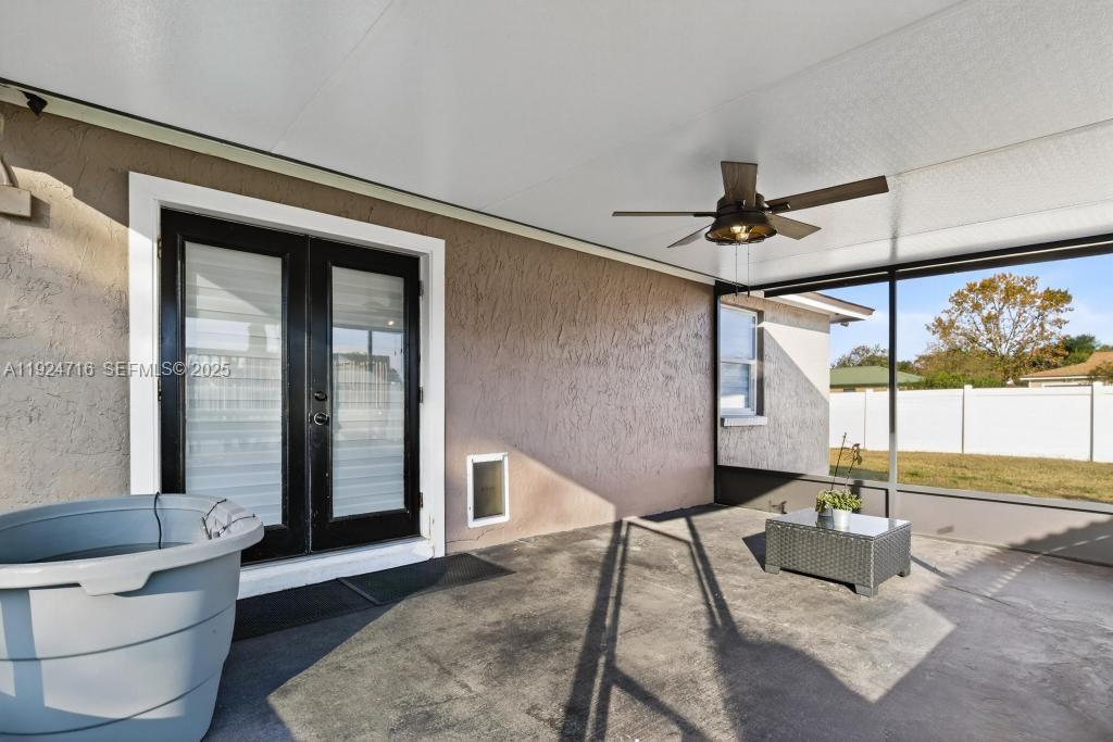 8210 Sailmaker Lane Jacksonville, FL 32210 - Photo 60 of 61 a living room with a couch and a table