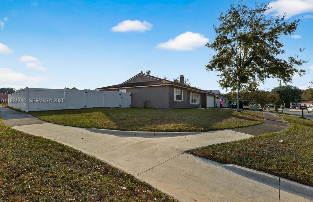 8210 Sailmaker Lane Jacksonville, FL 32210 - Photo 6 of 61 a view of a house with a yard