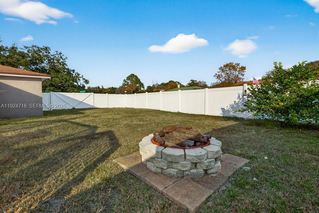 8210 Sailmaker Lane Jacksonville, FL 32210 - Photo 7 of 61 a view of a lake from a yard