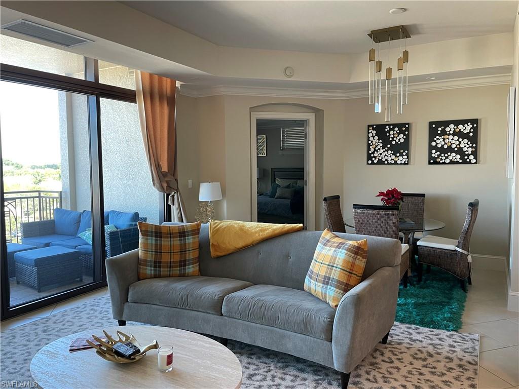 9115 Strada Place, Unit 5417 Naples, FL 34108 - Photo 8 of 21 a living room with furniture and a window