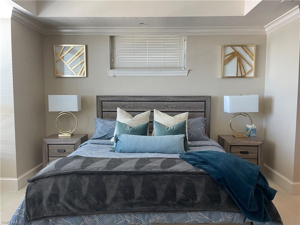 9115 Strada Place, Unit 5417 Naples, FL 34108 - Photo 10 of 21 a bedroom with a bed and wooden floor
