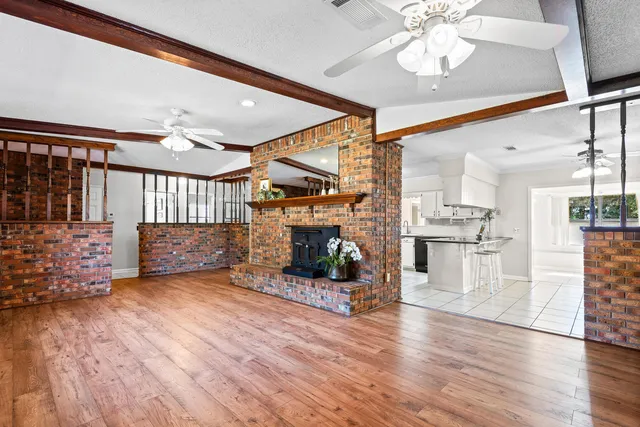 a kitchen with stainless steel appliances granite countertop a sink and cabinets