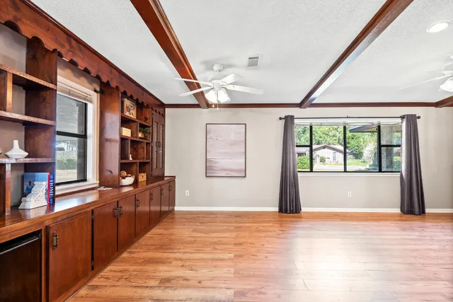 a kitchen with stainless steel appliances a sink and a refrigerator