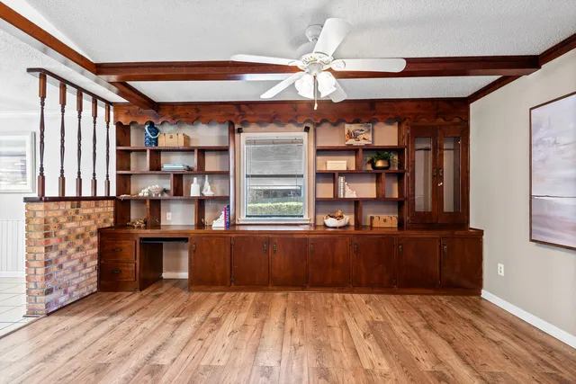 a kitchen with refrigerator and stove