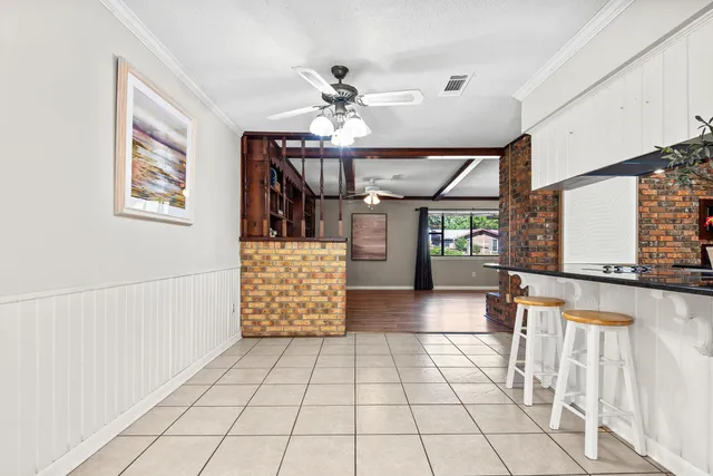 a kitchen with stainless steel appliances granite countertop a white sink refrigerator and cabinets