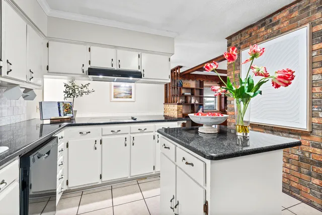 a view of livingroom with furniture chandelier and window