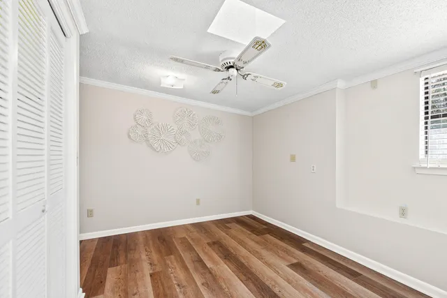 a view of a house with backyard sitting area and garden