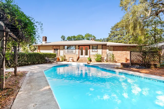a view of a house with a yard and plants