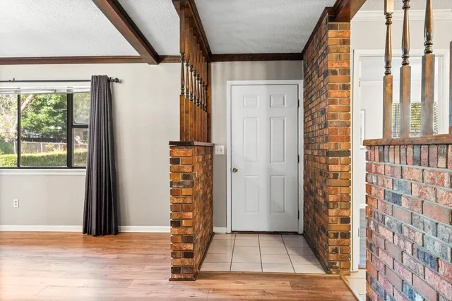 a view of living room with furniture and a fireplace