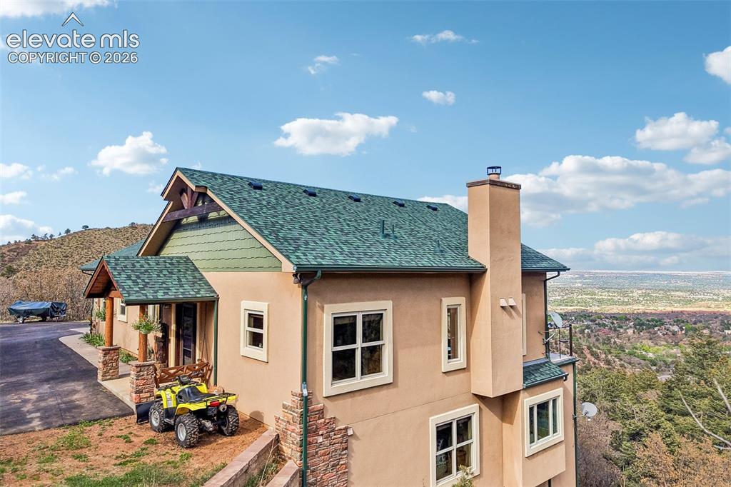 858 Oak Ridge Road Manitou Springs, CO 80829 - Photo 4 of 50 Front of this immaculate mountain home. Just look at those views!!!