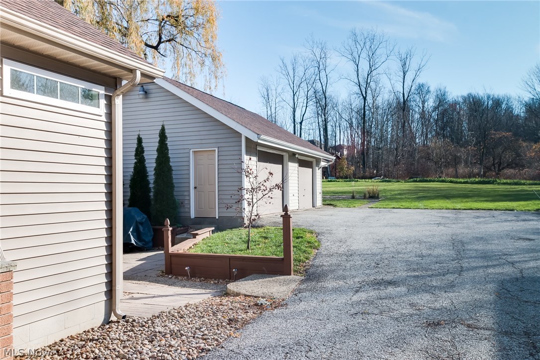 11516 Girdled Road Painesville, OH 44077 - Photo 23 of 24 Great view of the back yard that gives you lots of space for all your outdoor activities. The apple trees attract lots of deer and wildlife.