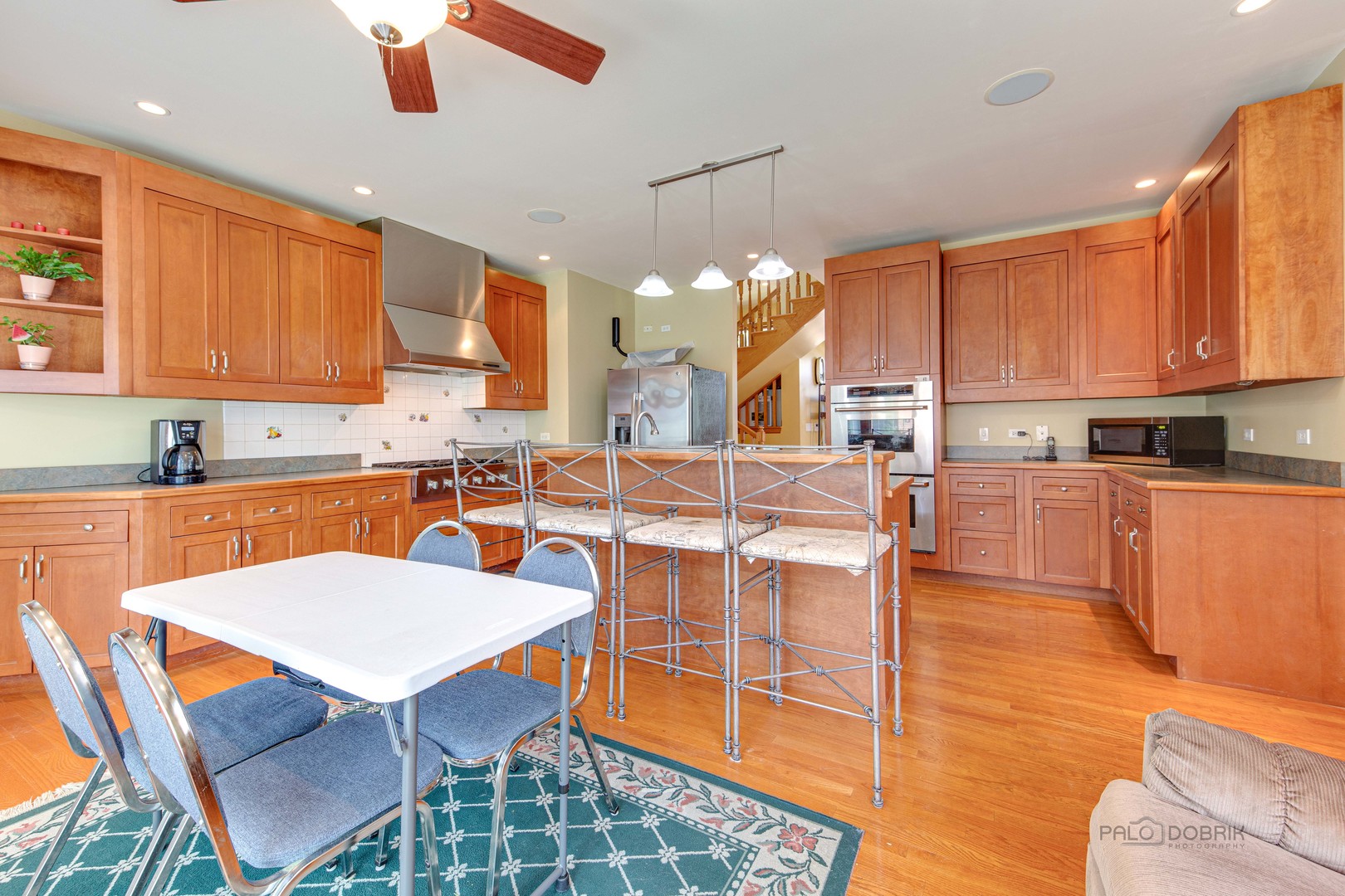 1865 Everett Avenue Des Plaines, IL 60018 - Photo 12 of 38 a large kitchen with a table and chairs