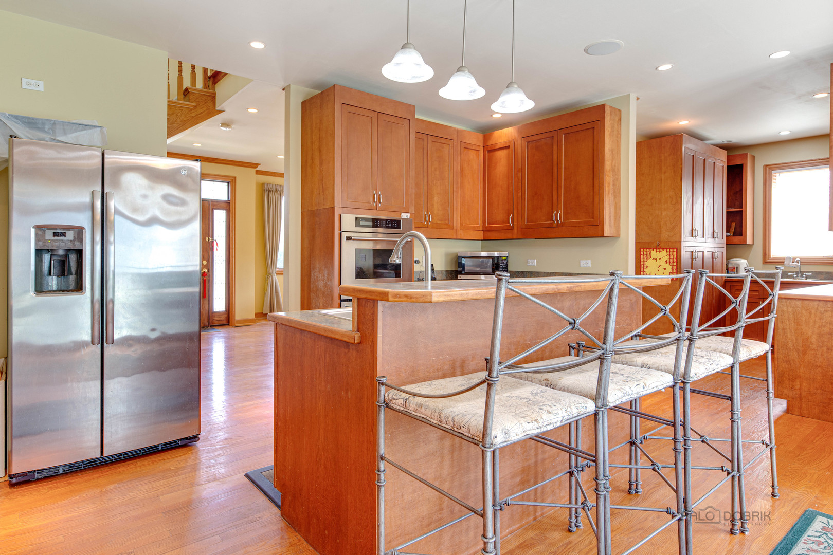 1865 Everett Avenue Des Plaines, IL 60018 - Photo 14 of 38 a kitchen with stainless steel appliances granite countertop a refrigerator a oven and a sink with cabinets