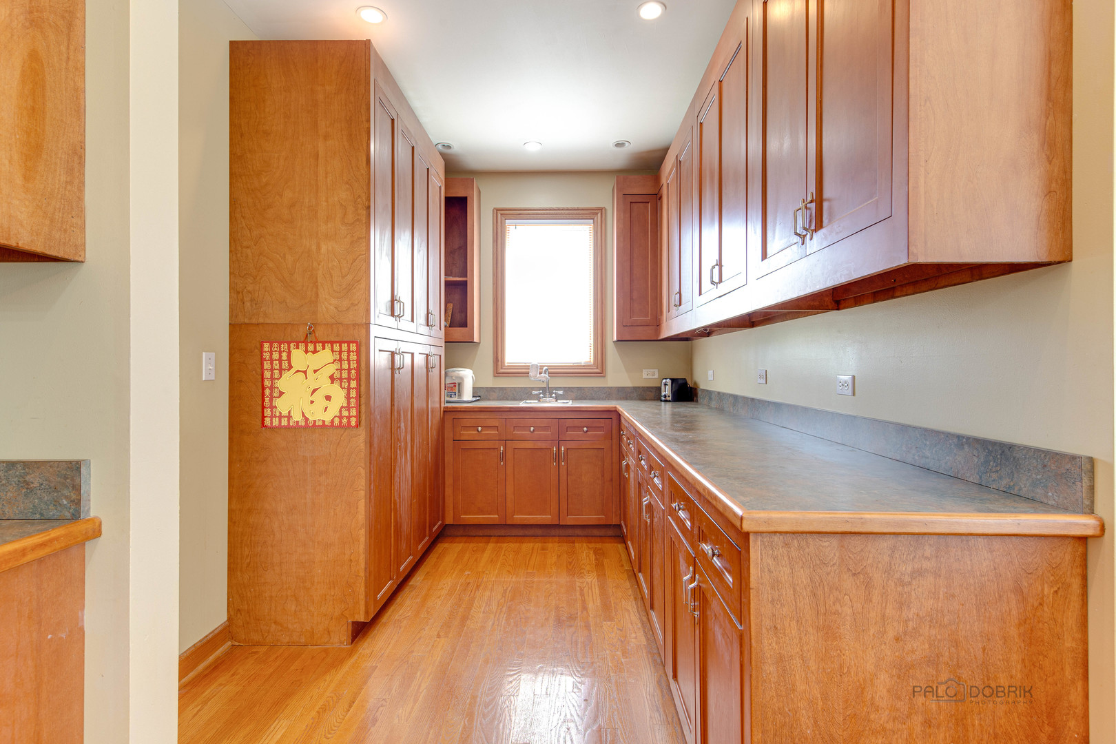 1865 Everett Avenue Des Plaines, IL 60018 - Photo 15 of 38 a kitchen with stainless steel appliances granite countertop a sink and cabinets