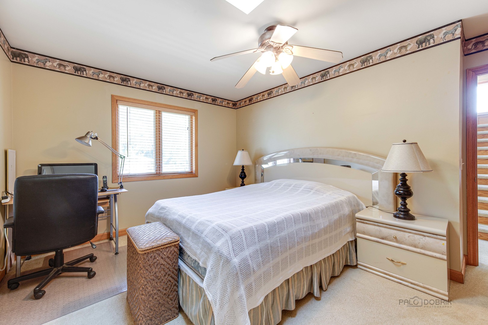 1865 Everett Avenue Des Plaines, IL 60018 - Photo 20 of 38 a bedroom with a bed and a chandelier