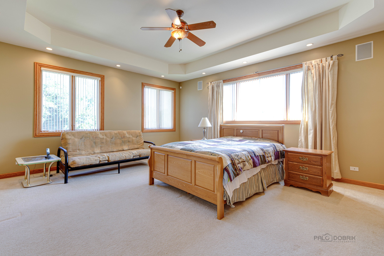 1865 Everett Avenue Des Plaines, IL 60018 - Photo 23 of 38 a spacious bedroom with a bed and a chandelier