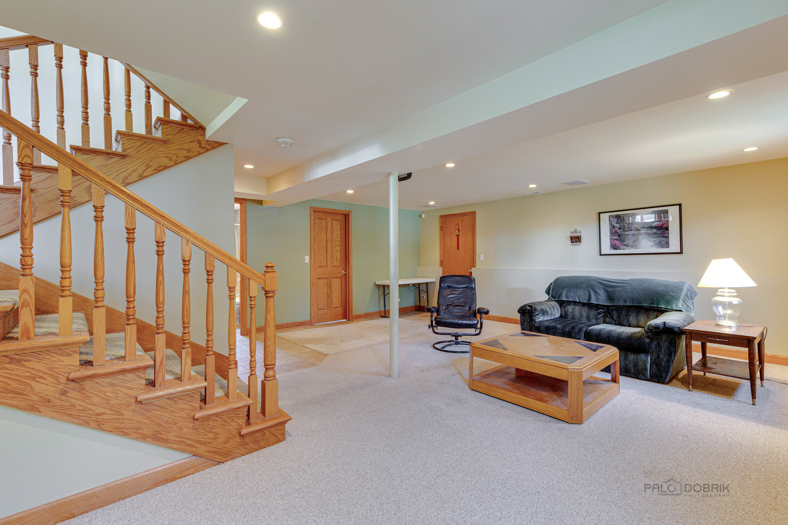 1865 Everett Avenue Des Plaines, IL 60018 - Photo 28 of 38 a living room with furniture flat screen tv and a table