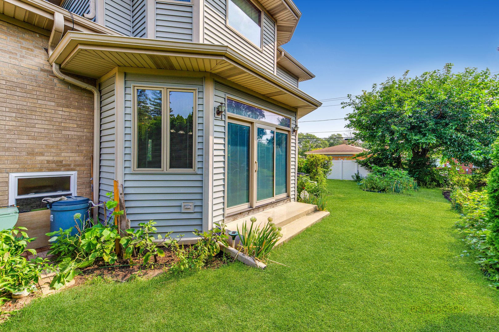 1865 Everett Avenue Des Plaines, IL 60018 - Photo 32 of 38 a view of a house with a yard and plants