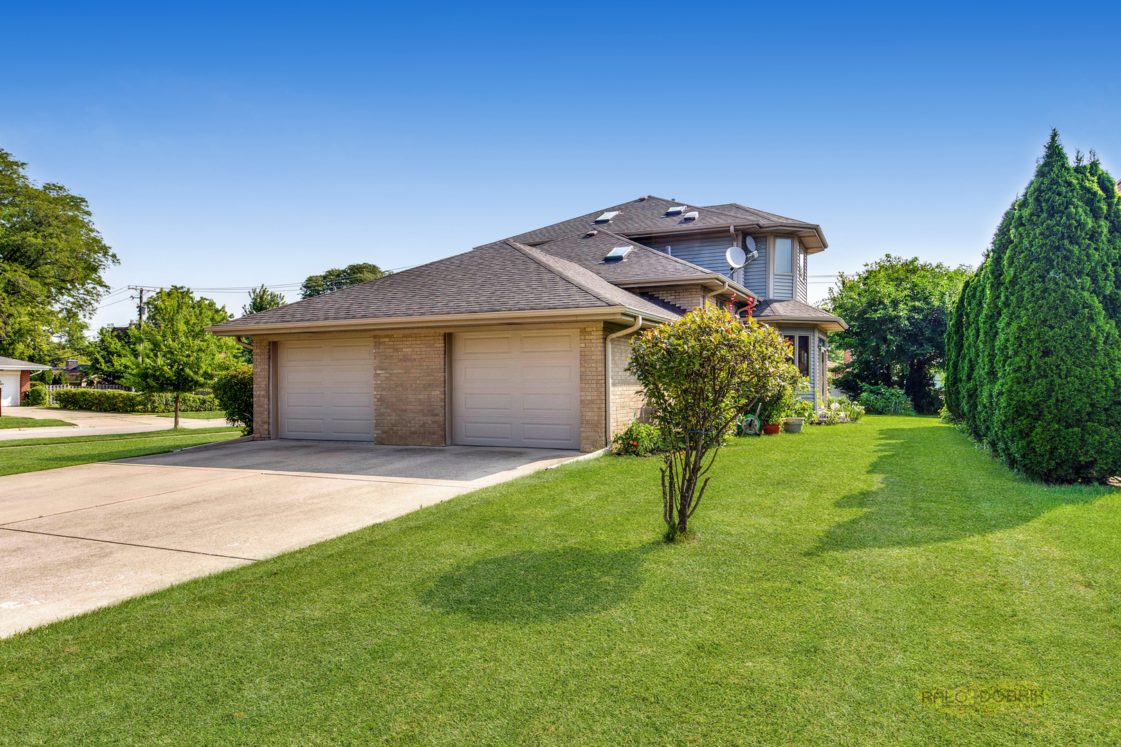 1865 Everett Avenue Des Plaines, IL 60018 - Photo 34 of 38 a front view of a house with a yard and garage