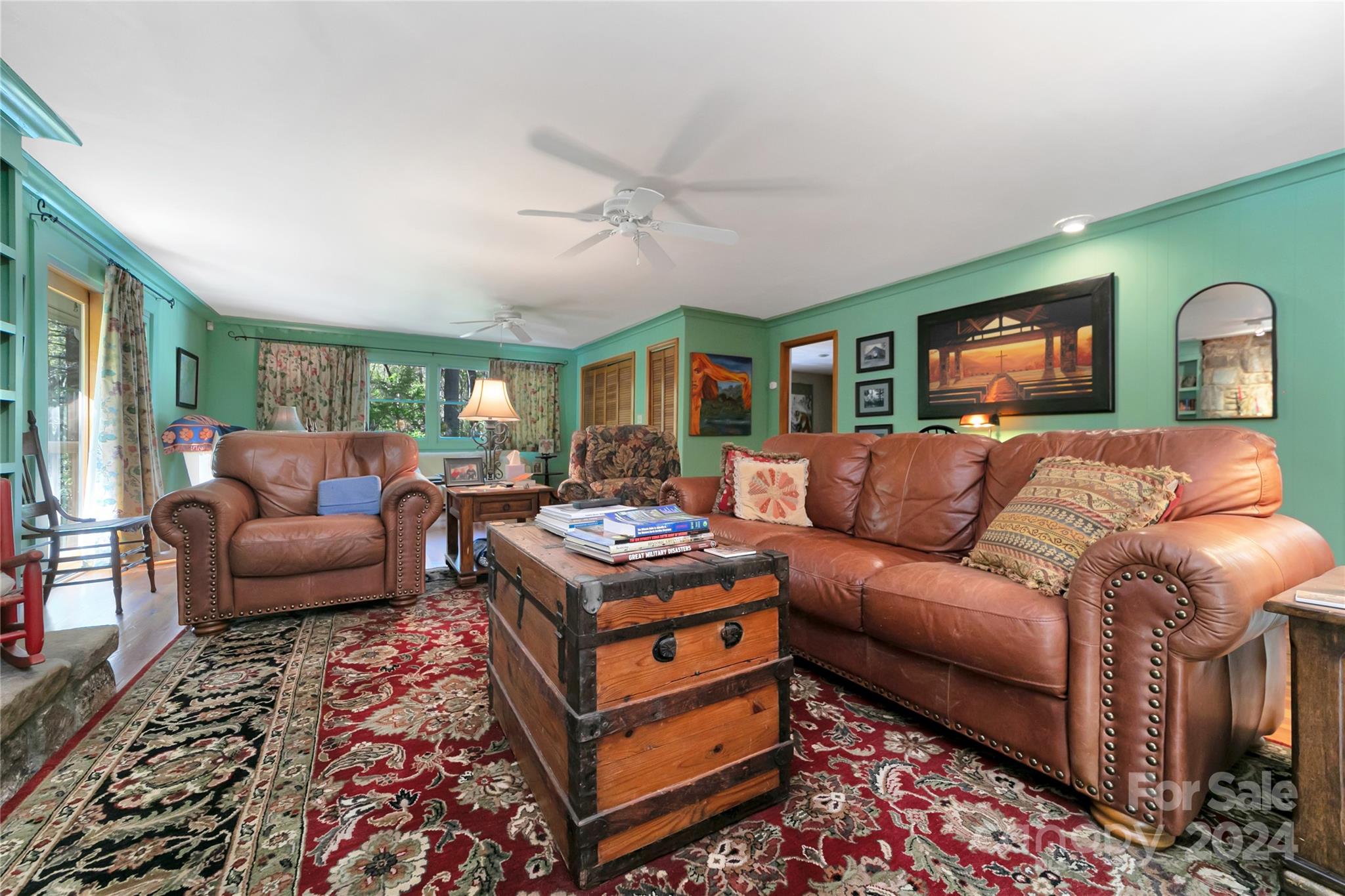 50 Summer Road Cedar Mountain, NC 28718 - Photo 13 of 41 a living room with furniture and a flat screen tv